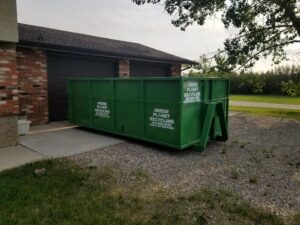 A green garbage container from Green Planet Recycling Solutions somewhere close to Calgary